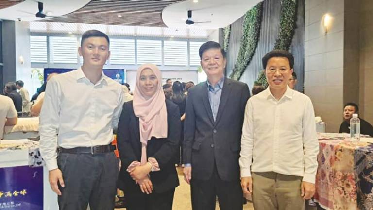 From left: Han, Rozita, Tan and Shaoxing Keqiao Textile City Overseas Market Promotion Association executive president Wei Changjun, during the event.