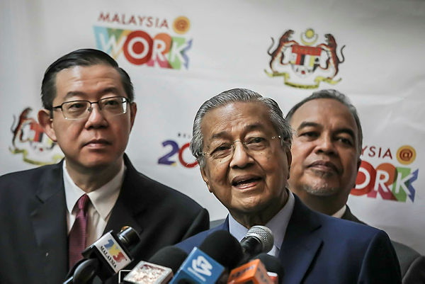 Prime Minister Tun Dr Mahathir Mohamad (centre) speaking during the International Social Well-Being Conference 2019 and the launch of Malaysia@Work at Grand Hyatt Hotel, Kuala Lumpur, today. — Sunpix by Adib Rawi Yahya