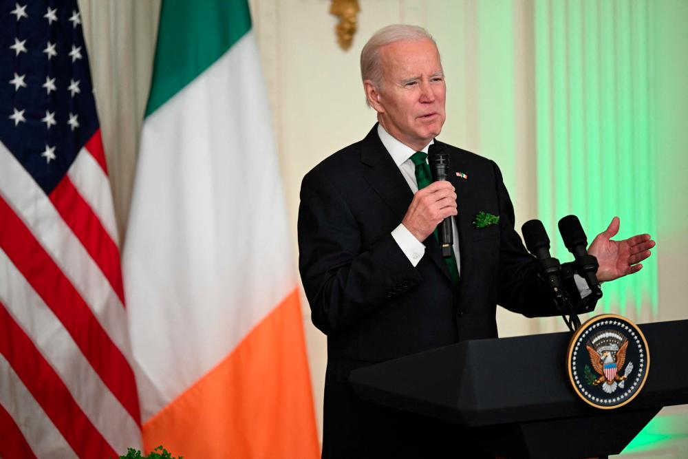 US President Joe Biden hosts Irish Taoiseach Leo Varadkar, not pictured, for a Shamrock presentation and reception in the East Room of the White House in Washington, DC, on March 17, 2023. - AFPPIX