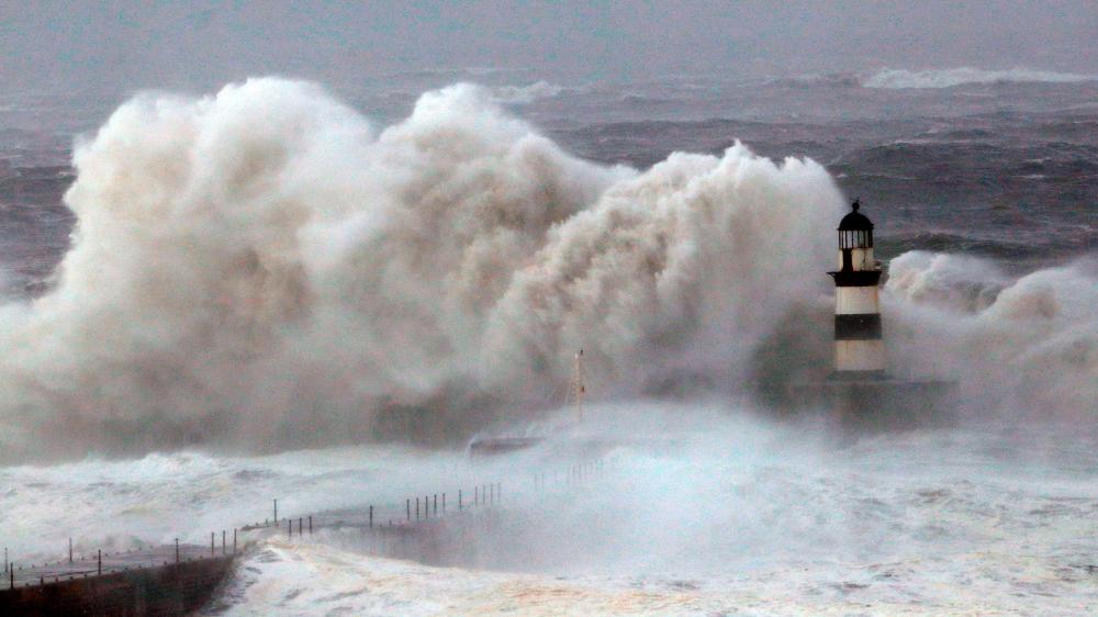 Waves crash against the pier wall at Seaham Lighthouse during Storm Arwen, in Seaham, Britain, November 27, 2021. REUTERSpix