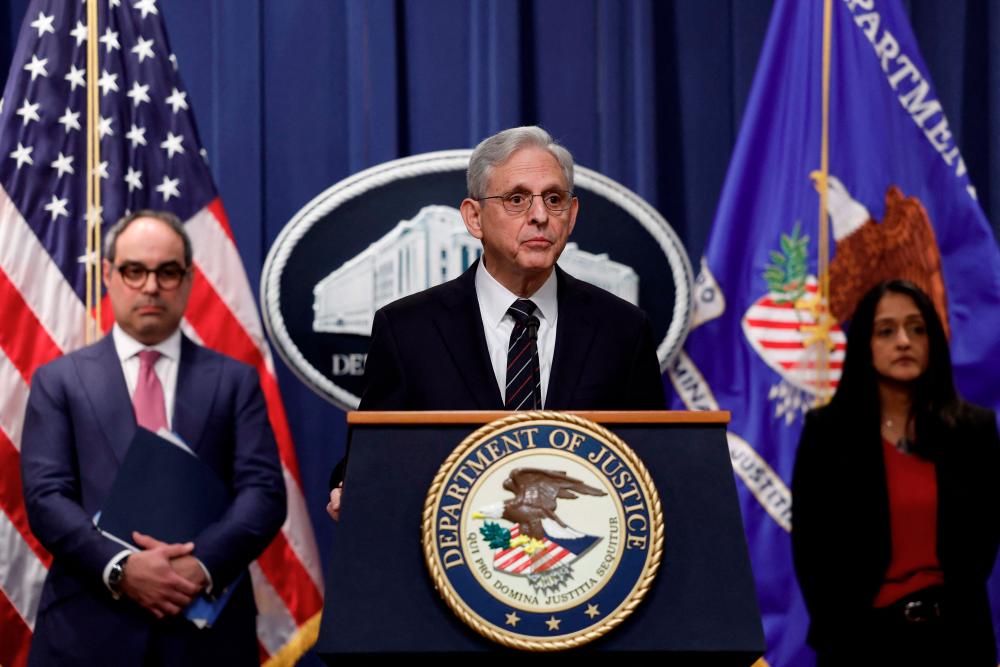 US Attorney General Merrick Garland is joined by Assistant Attorney General Jonathan Kanter of the Antitrust Division (left) and US Associate Attorney General Vanita Gupta as he speaks during a news conference at the Justice Department in Washington DC to announce a new antitrust lawsuit against Google on Tuesday. – AFPpic