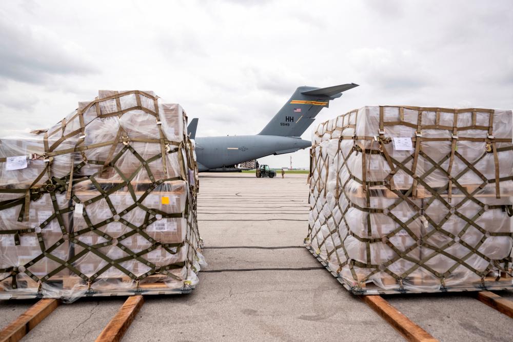Crew members of an Air Force C-17 aircraft unload Nestle baby formula after its arrival from Ramstein Air Base in Germany, in Indianapolis, Indiana, U.S. May 22, 2022. Doug McSchooler/USA TODAY NETWORK via REUTERSpix