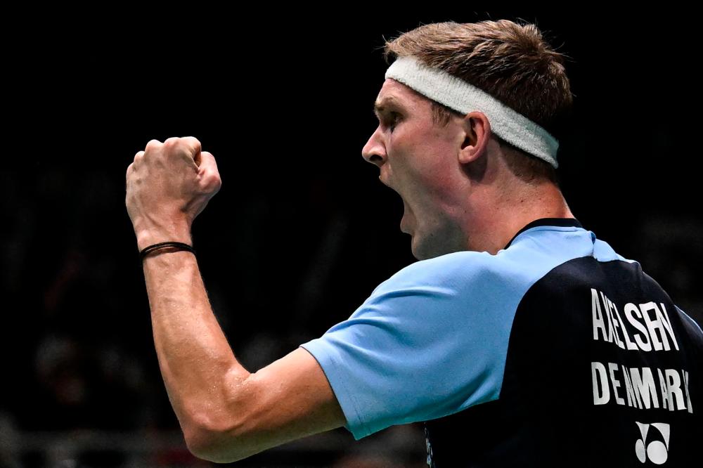 Denmark’s Viktor Axelsen reacts after scoring a point against Indonesia’s Anthony Sinisuka Ginting during their men’s singles quarter-final match at the Malaysia Open badminton tournament in Kuala Lumpur on July 1, 2022. AFPPIX