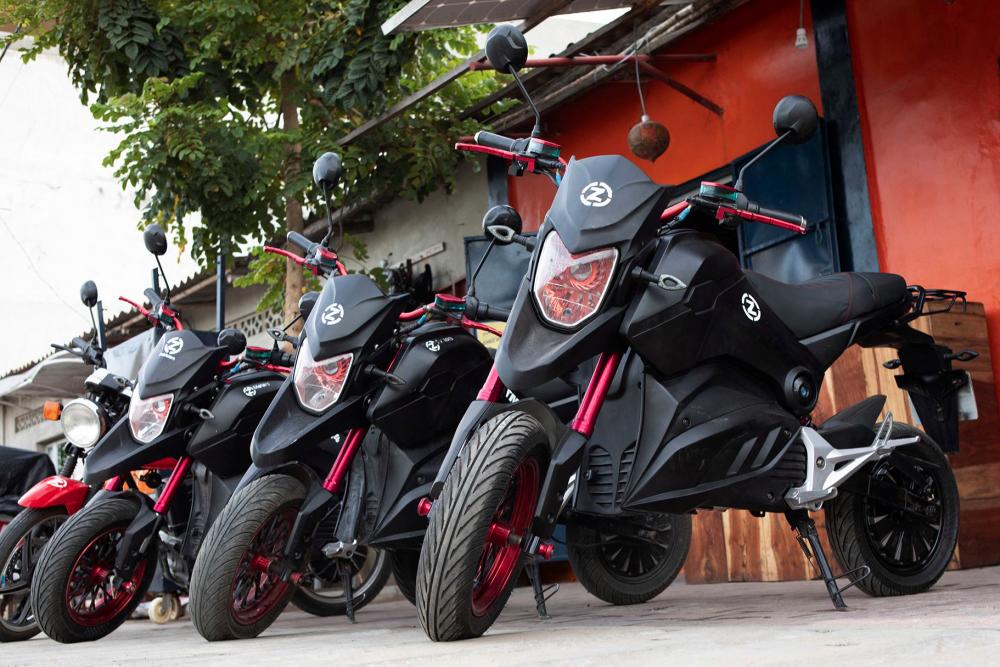 Electric motorcycles from the company Zed Motors are displayed in front of a store in Cotonou, on October 21, 2022. For several months, many Beninese have opted for this mode of transport because of its ecological character and its affordable cost and accessibility. - AFPPIX