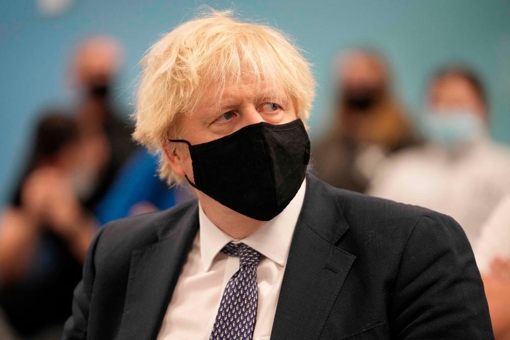 British Prime Minister Boris Johnson attends a pre-raid briefing at Merseyside Police headquarters as part of 'Operation Toxic' to infiltrate County Lines drug dealings in Liverpool on December 6, 2021. AFPpix