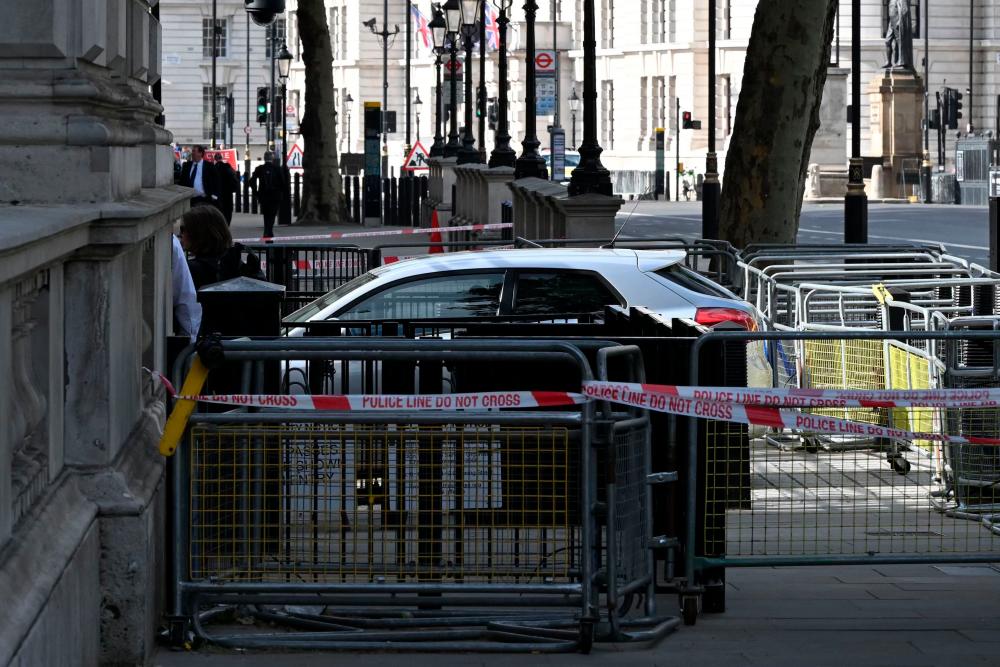 A car is seen between barriers at the gates of Downing Street, in central London on May 25, 2023, after being driven into the front gates of Downing Street, the official residence of Britain’s Prime Minister/AFPPix
