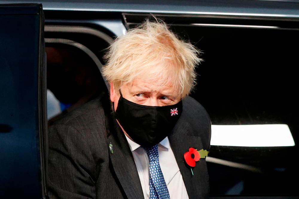 UK PM fights for survival after lockdown party hangover