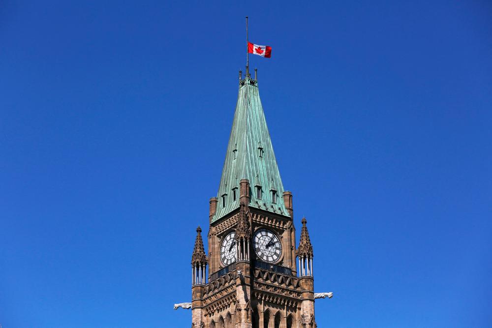 A Canadian flag flies at half-staff at the top of the Peace Tower after the death of Britian’s Queen Elizabeth II on September 8, 2022 in Ottawa/AFPPix