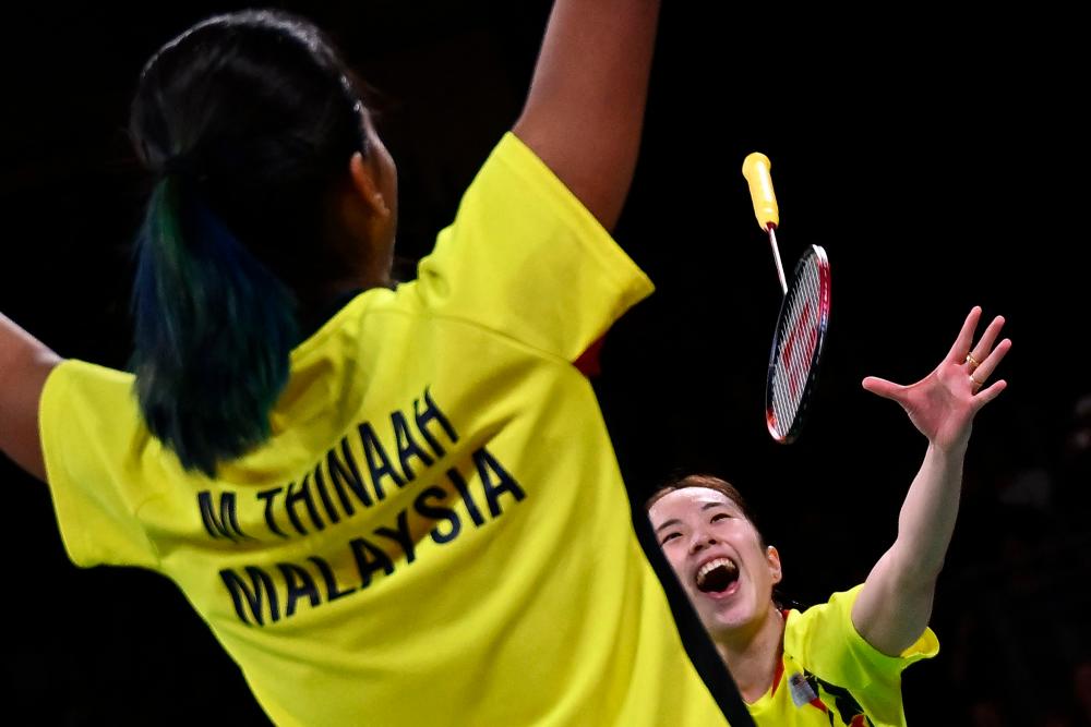Malaysia’s Koon Le Pearly Tan (R) and Malaysia’s Muralitharan Thinaah celebrate winning against England’s Chloe Birch and Lauren Smith in their women’s doubles gold medal badminton match on day eleven of the Commonwealth Games at the NEC arena in Birmingham, central England, on August 8, 2022. AFPPIX