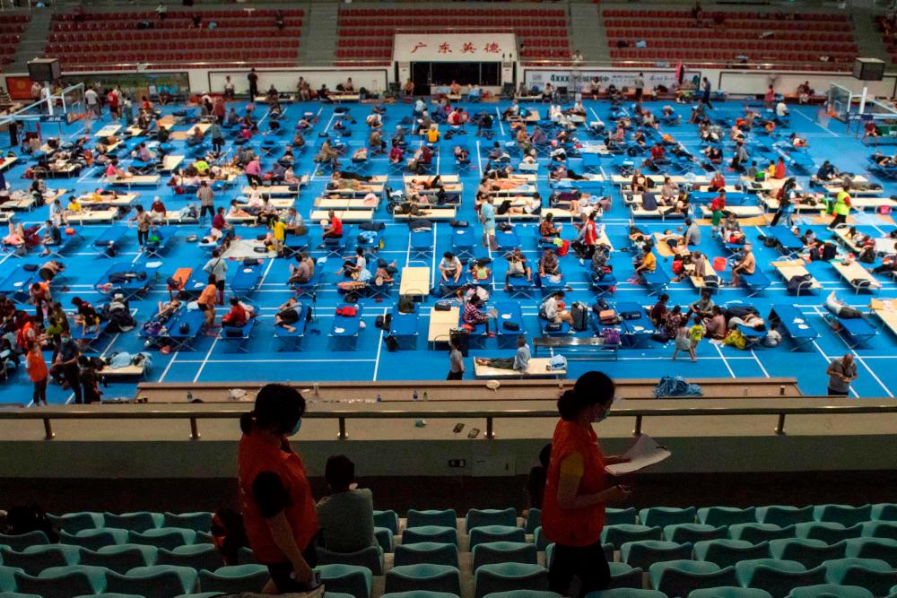 This photo taken on June 22, 2022 shows people affected by floods at a temporary shelter after heavy rains in Yingde, Qingyuan city, in China’s southern Guangdong province. AFPPIX