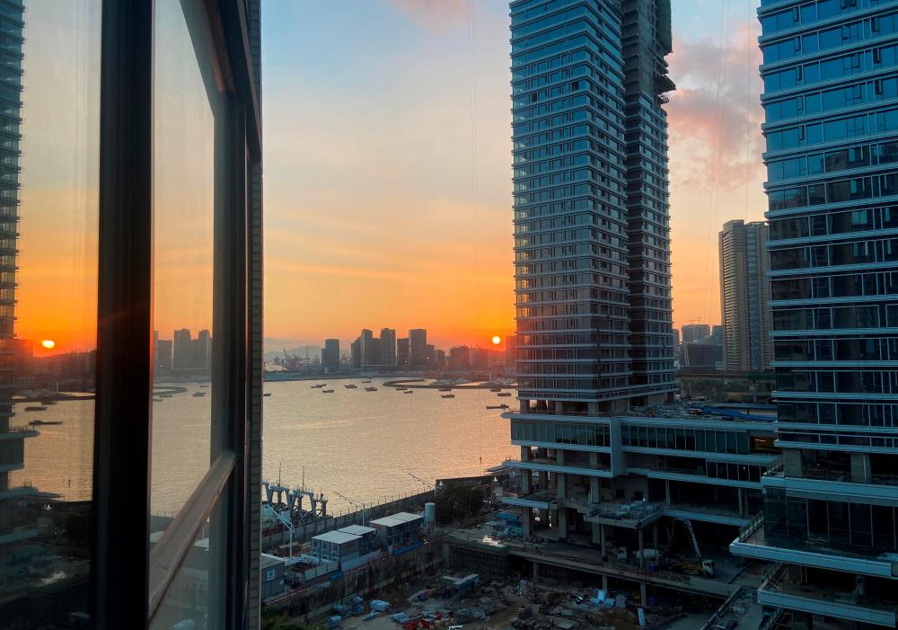 Under-construction apartments are pictured from a building during sunset in the Shekou area of Shenzhen, Guangdong province, China November 7, 2021. REUTERSpix