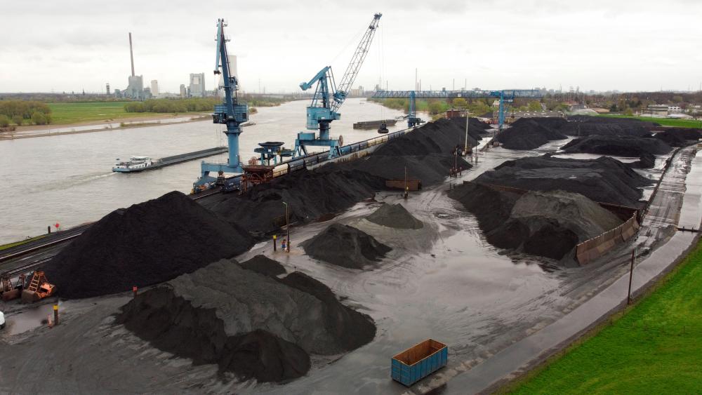 Piles of coal at a dry bulk terminal of German Rheinberg-Orsoy harbour along the Rhine in Rheinberg near Duisburg, Germany, on Wednesday. – Reuterspix