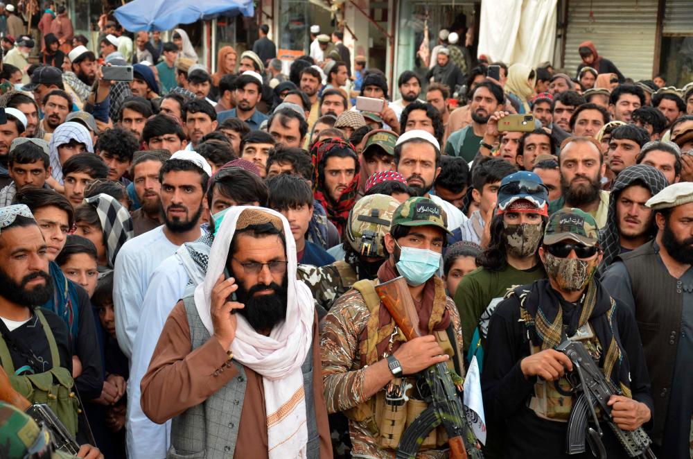 Demonstrators take part in a protest against Pakistani airstrikes, in Khost on April 16, 2022. At least five children and a woman were killed in an eastern Afghan province when Pakistani military forces fired rockets along the border in a pre-dawn assault Saturday, an official and a resident said. AFPPIX