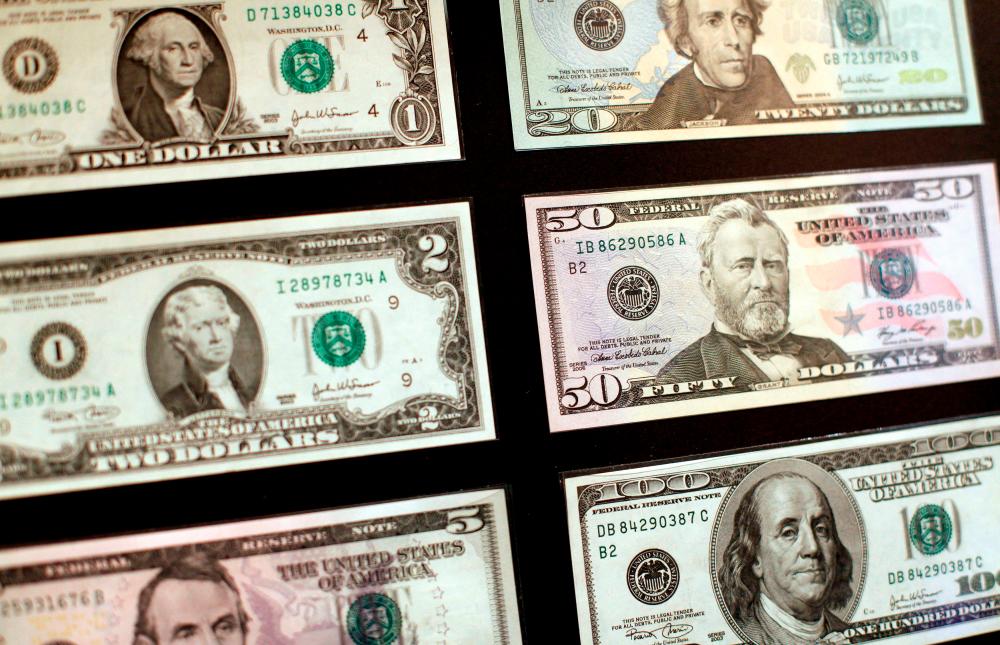 USdollar banknotes are seen at the Museum of American Finance in New York. With the dollar scaling new multi-decade highs, positioning for a pullback can be painful. – Reuterspix
