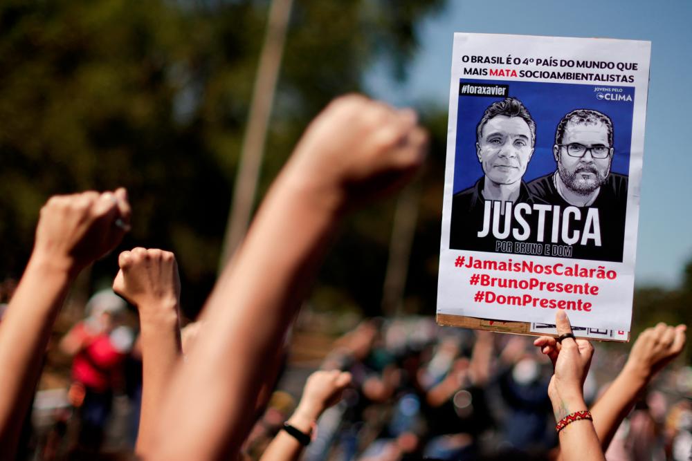 People take part in a protest to demand justice for journalist Dom Phillips and indigenous expert Bruno Pereira, who were murdered in the Amazon, in Brasilia, Brazil June 19, 2022. REUTERSpix