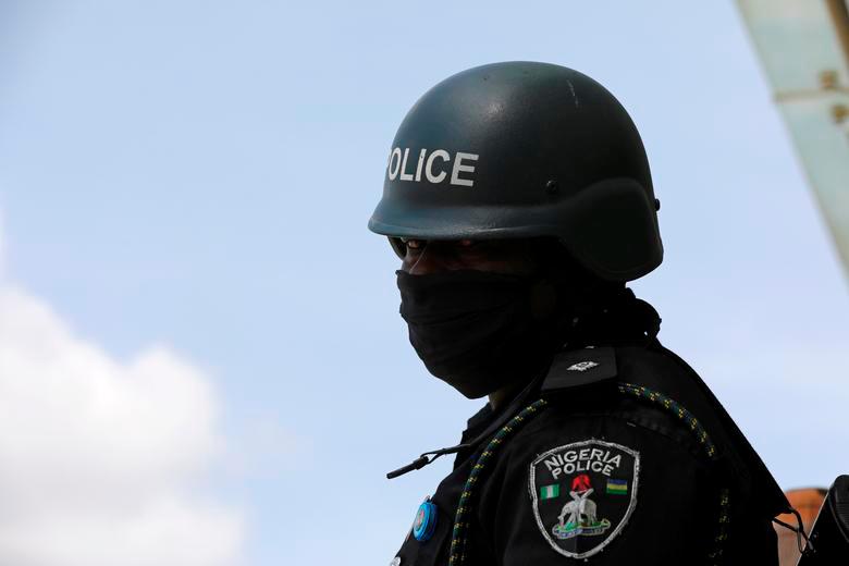 FILE PHOTO: A policeman wears a protective face mask, as the spread of the coronavirus disease (COVID-19) continues, in Abuja, Nigeria. May 11, 2020. REUTERSPIX