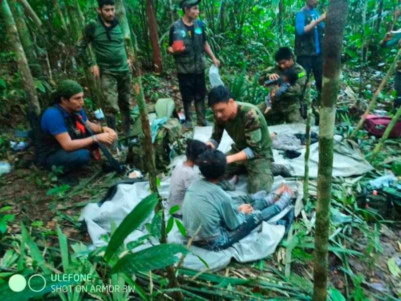 Colombian Presidency, members of the army assist four indigenous children who were found alive after spending more than a month lost in the Colombian Amazon jungle following the crash of a small plane//AFPix