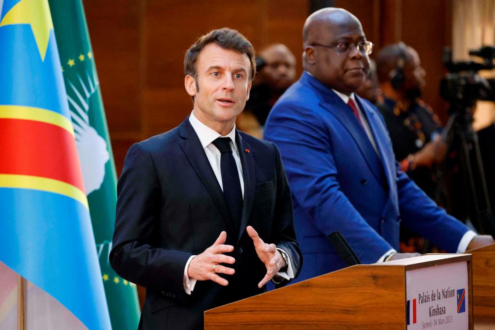 France’s President Emmanuel Macron (L) and Democratic Republic of Congo’s President Felix Tshisekedi hold a press conference during their meeting at the Palace of the Nation in Kinshasa, on March 4, 2023. The French president is in Kinshasa on the fourth and last leg of an African tour. AFPPIX