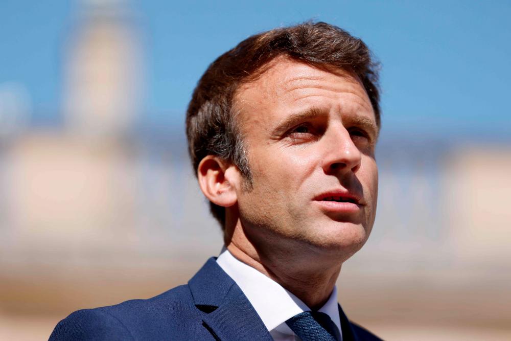 France's President Emmanuel Macron talks to the press at the Elysee presidential palace before a meeting with Argentina's President in Paris on May 13, 2022. AFPpix