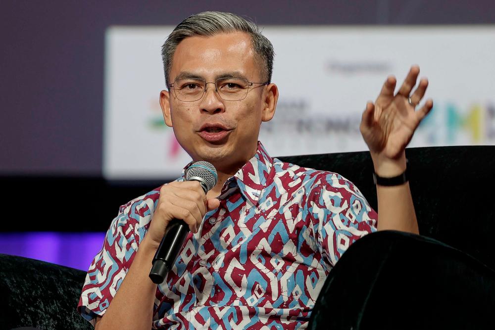 KUALA LUMPUR, 19 Mac -- Menteri Komunikasi dan Digital Fahmi Fadzil berucap pada Forum Pameran Memperkasa Belia 2023 di Pusat Konvensyen Kuala Lumpur (KLCC) hari ini. - fotoBERNAMA