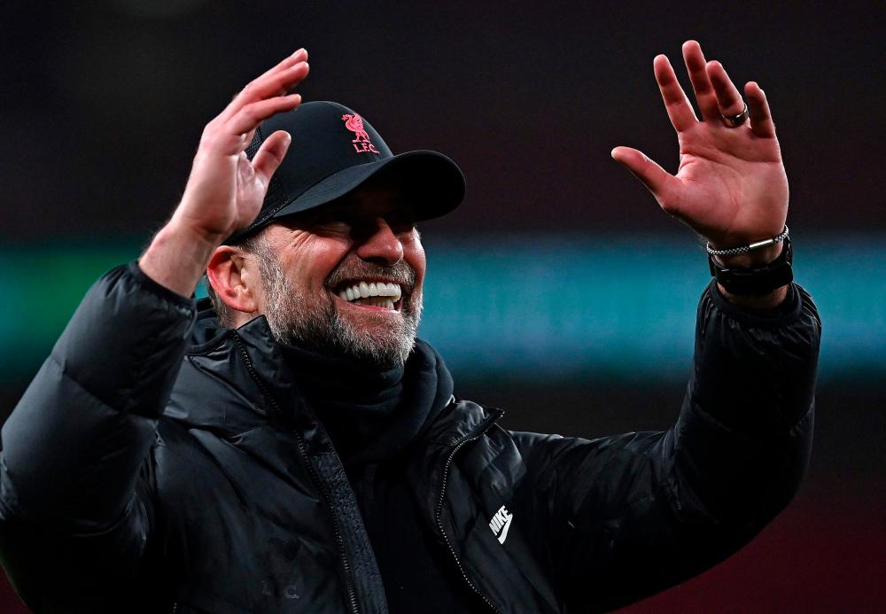 Liverpool’s German manager Jurgen Klopp celebrates after winning the English League Cup final football match between Chelsea and Liverpool at Wembley Stadium, north-west London on February 27, 2022. AFPPIX