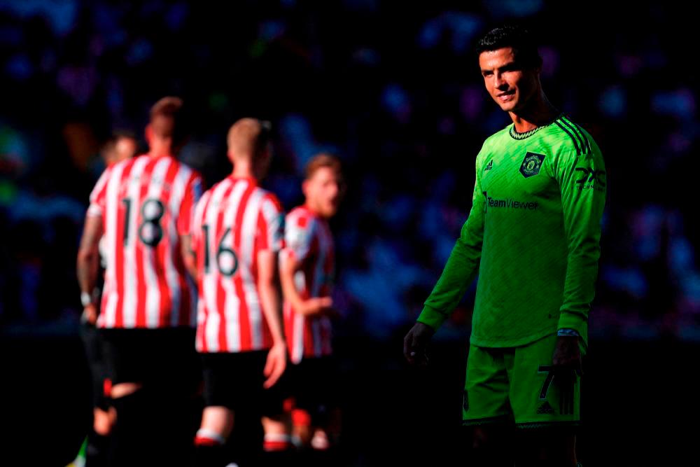 Manchester United’s Portuguese striker Cristiano Ronaldo reacts after missing a chance during the English Premier League football match between Brentford and Manchester United at Brentford Community Stadium in London on August 13, 2022. AFPPIX