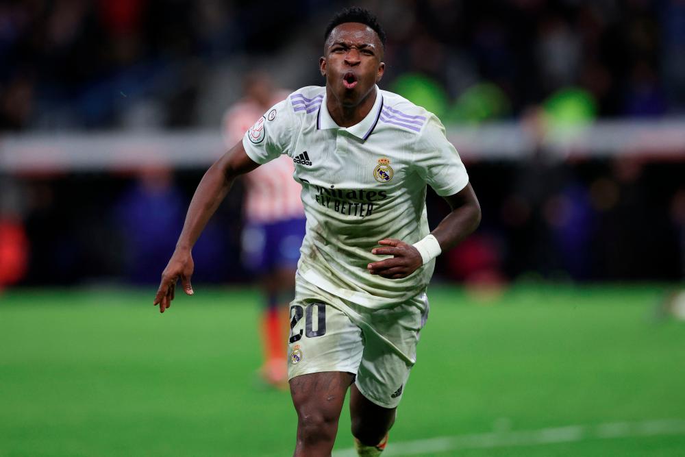 Real Madrid's Brazilian forward Vinicius Junior celebrates after scoring his team's third goal during the Copa del Rey (King's Cup), quarter final football match between Real Madrid CF and Club Atletico de Madrid at the Santiago Bernabeu stadium in Madrid on January 26, 2023. AFPPIX