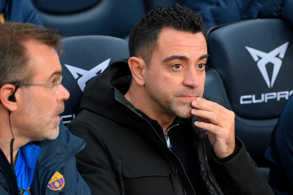 Barcelona's Spanish coach Xavi sits on the bench before the Spanish League football match between FC Barcelona and Real Betis at the Camp Nou stadium in Barcelona on December 4, 2021. AFPpix