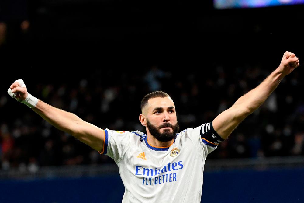 Real Madrid's French forward Karim Benzema celebrates after scoring his team's first goal during the Spanish league football match between Real Madrid CF and Athletic Club Bilbao at the Santiago Bernabeu stadium in Madrid on December 1, 2021. AFPpix