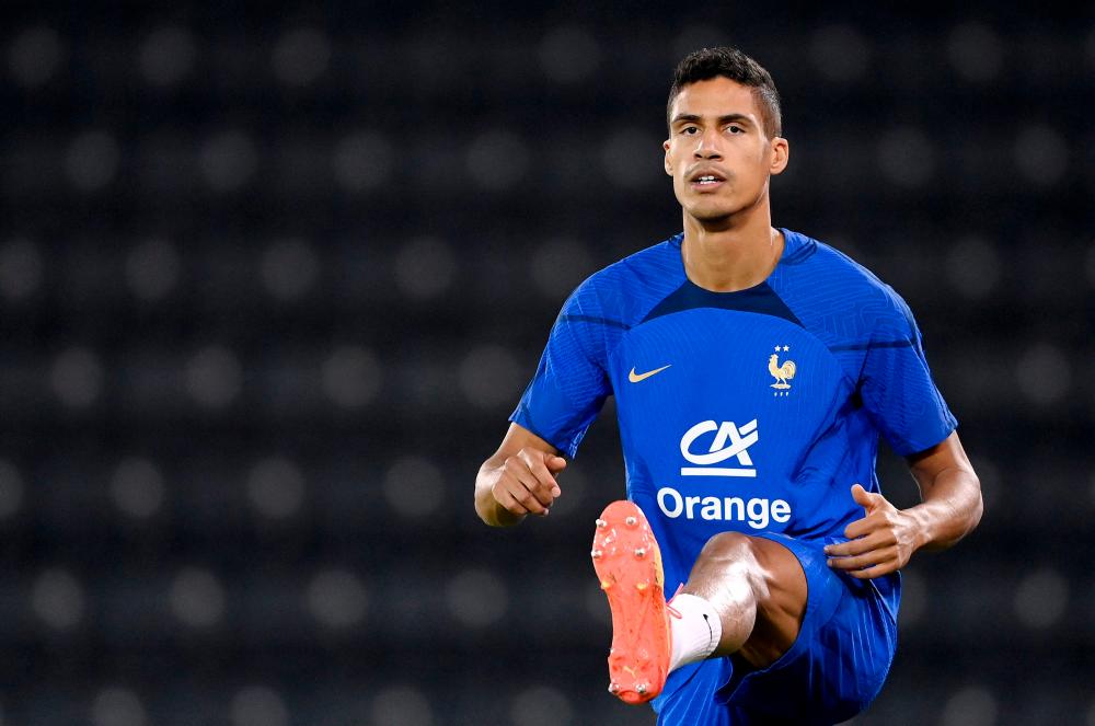 France’s defender #04 Raphael Varane takes part in a training session at the Jassim-bin-Hamad Stadium in Doha on November 24, 2022, during the Qatar 2022 World Cup football tournament. AFPPIX