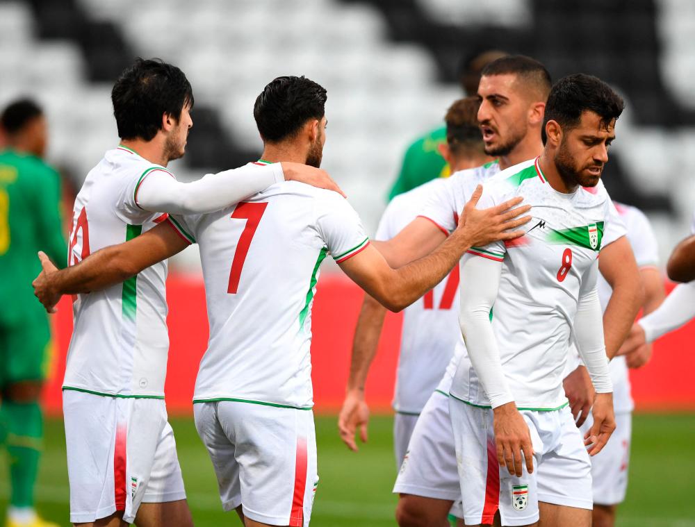 Iran’s players celebrate during the friendly football match between Senegal and Iran in Moedling, Austria on September 27, 2022. AFPPIX