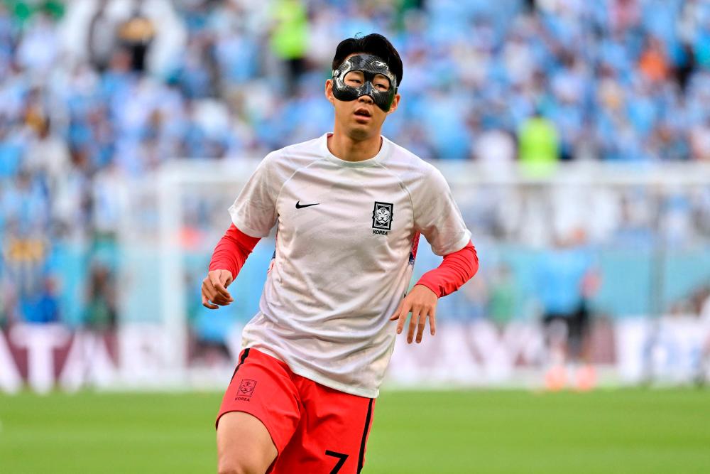 South Korea’s midfielder #07 Son Heung-min warms up before the start of the Qatar 2022 World Cup Group H football match between Uruguay and South Korea at the Education City Stadium in Al-Rayyan, west of Doha on November 24, 2022. AFPPIX
