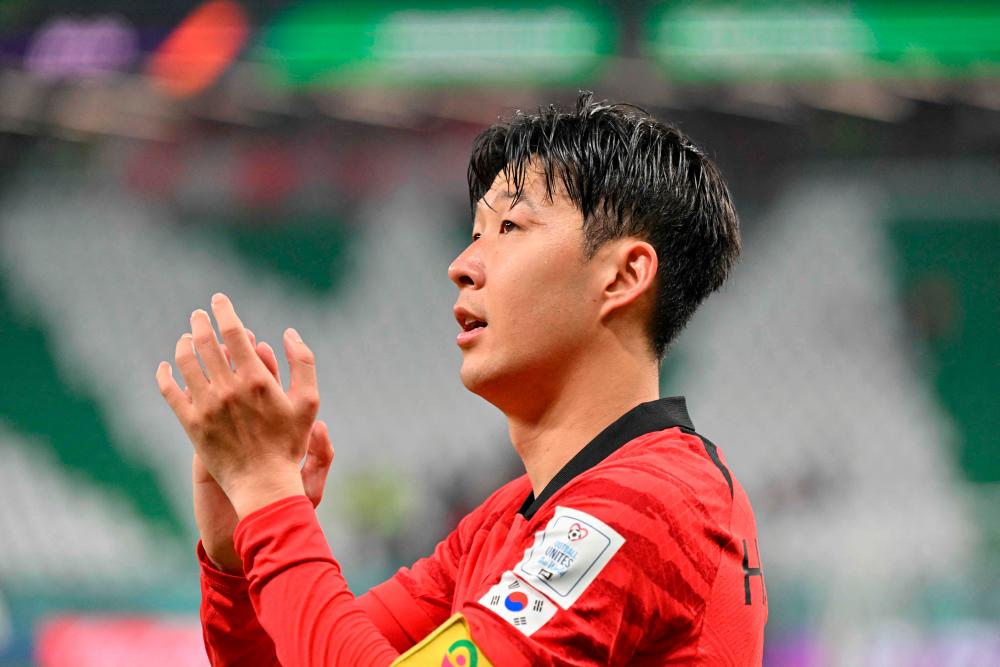 South Korea’s midfielder #07 Son Heung-min celebrates at the end of the Qatar 2022 World Cup Group H football match between South Korea and Portugal at the Education City Stadium in Al-Rayyan, west of Doha on December 2, 2022/AFPPix