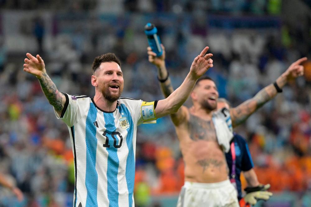 Argentina’s forward #10 Lionel Messi celebrates their win in the Qatar 2022 World Cup quarter-final football match between The Netherlands and Argentina at Lusail Stadium, north of Doha on December 9, 2022/AFPPix