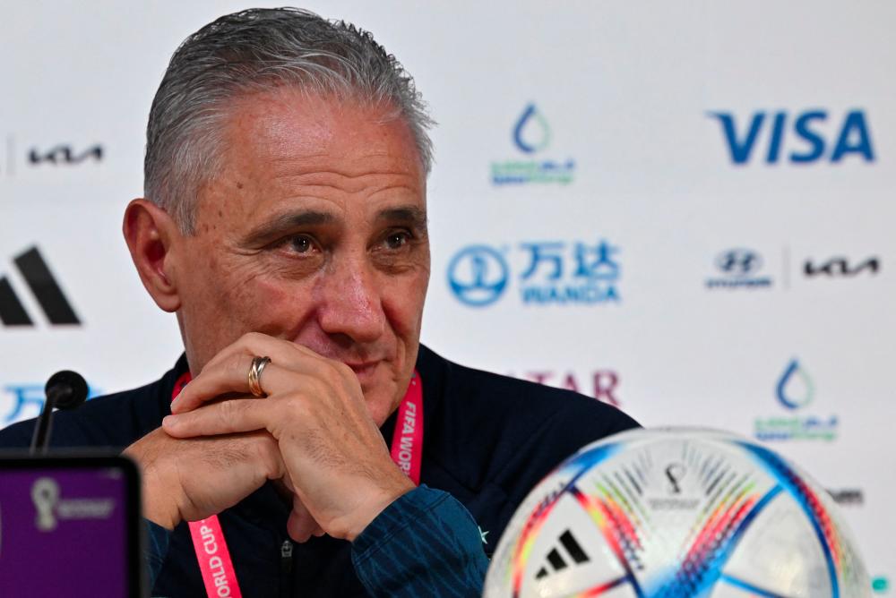Brazil's coach Tite gives a press conference at the Qatar National Convention Center (QNCC) in Doha on December 8, 2022, on the eve of the Qatar 2022 World Cup quarter final football match between Brazil and Croatia. - AFPPIX