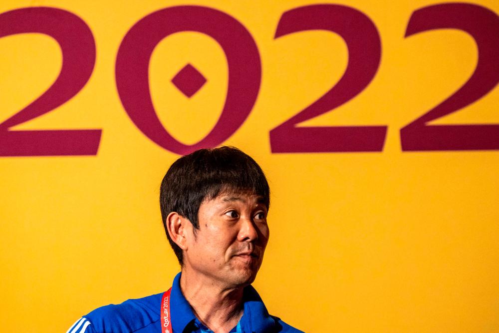 Japan’s coach Hajime Moriyasu poses on the green carpet ahead of a press conference at the Qatar National Convention Center (QNCC) in Doha on November 30, 2022, on the eve of the Qatar 2022 World Cup football match between Japan and Spain/AFPPix