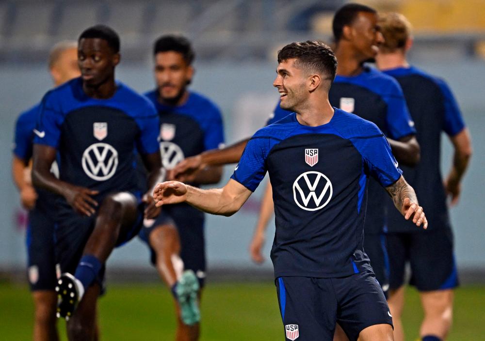 USA’s forward Christian Pulisic and teammates take part in a training session at Al Gharrafa Sports Club in Doha on November 27, 2022 during the Qatar 2022 World Cup football tournament. AFPPIX