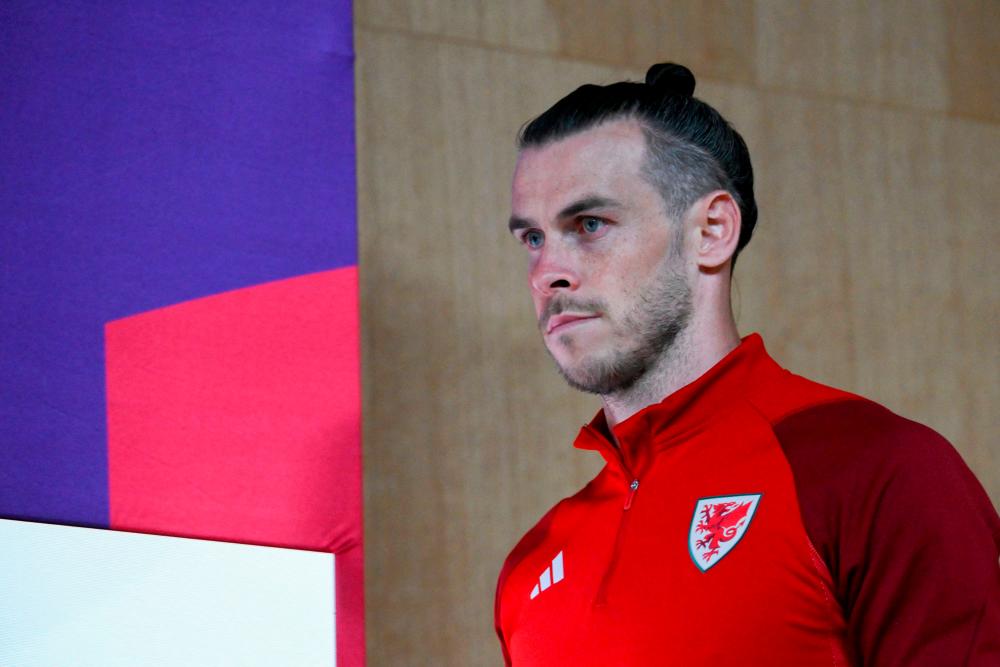 Wales’ forward Gareth Bale arrives for a press conference at the Qatar National Convention Center (QNCC) in Doha on November 28, 2022, on the eve of the Qatar 2022 World Cup football match between Wales and England. AFPPIX