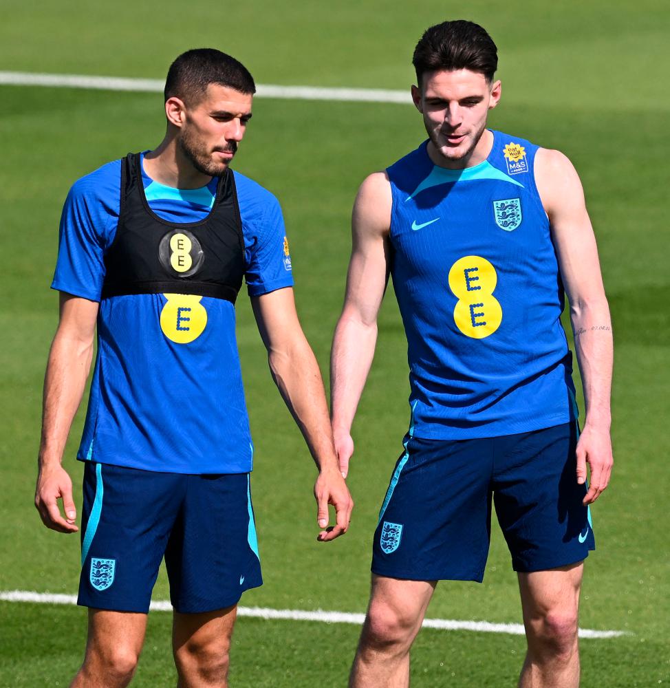 England’s Conor Coady (left) and Declan Rice take part in a training session at the Al Wakrah SC Stadium. – AFPPIX