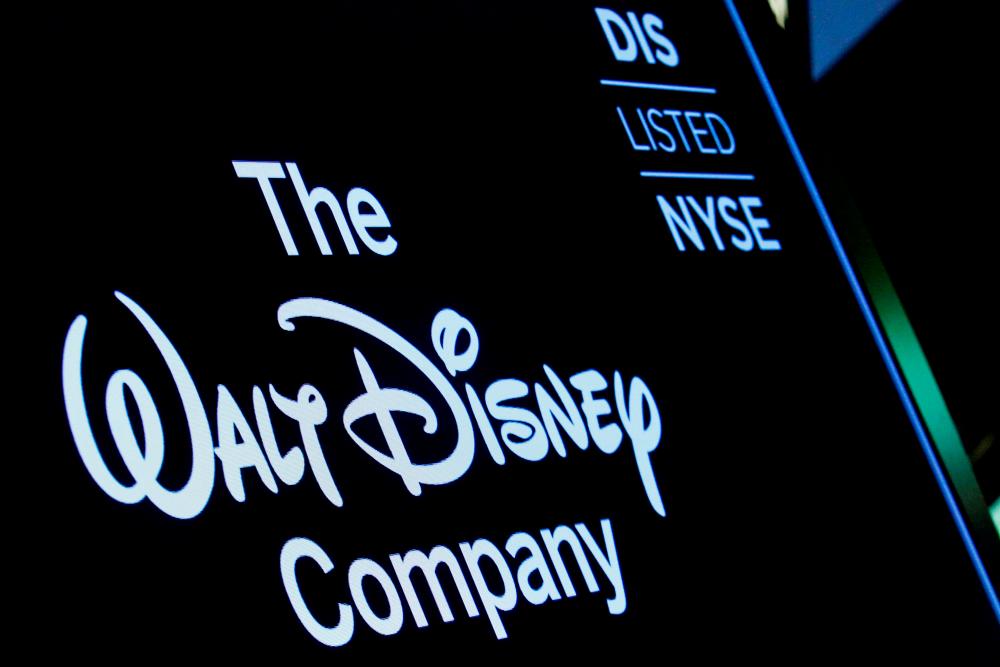 A screen shows the logo and a ticker symbol for The Walt Disney Company on the floor of the New York Stock Exchange. – Reuterspic