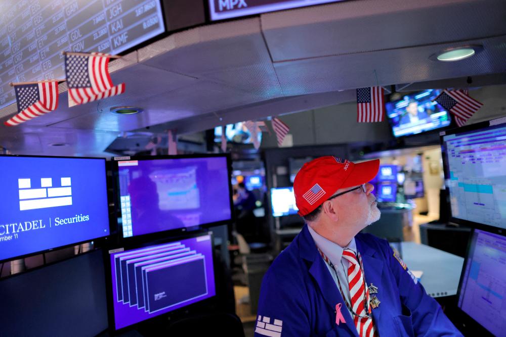 A trader working on the trading floor at the New York Stock Exchange. – Reuterspic