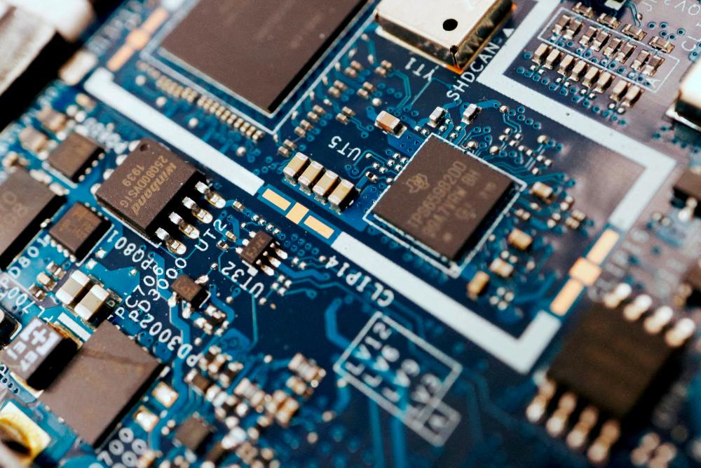 Semiconductor chips are seen on a circuit board of a computer. Picture for illustration purposes only. – Reuterspic