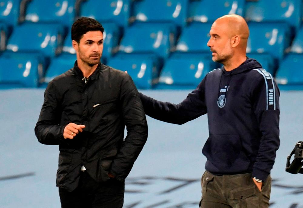 FILE PHOTO/Manchester City manager Pep Guardiola and Arsenal manager Mikel Arteta/REUTERSPIX