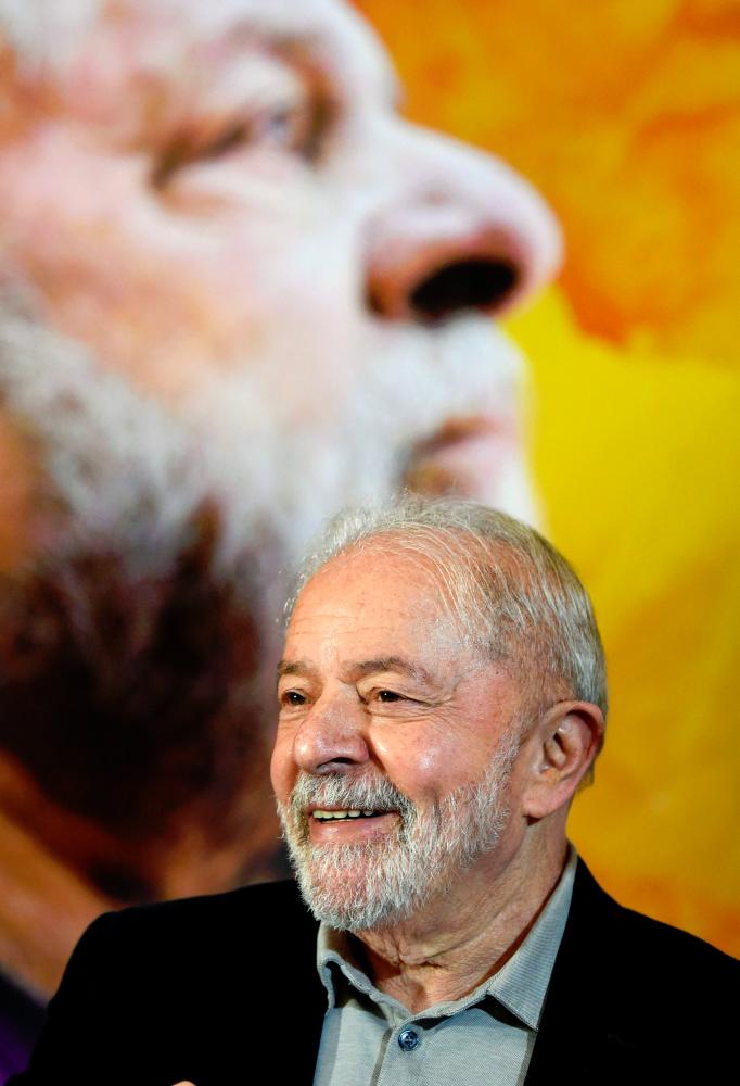In this file photo taken on April 28, 2022, former Brazilian President Luiz Inacio Lula da Silva smiles during a meeting in Brasilia with members of the Red Party to discuss the party’s support for his candidacy in the upcoming October elections. - AFPpix