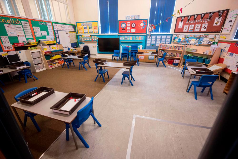 A file photo taken on May 18, 2020 shows a classroom, which has been rearranged with seating separated by 2m to provide an environment safe from Coronavirus for pupils and teachers at Marsden Infant and Nursery School in Marsden, near Huddersfield, northern England, ahead of the Government’s proposed recommencing of education for Reception and Year 1 classes. AFPPIX