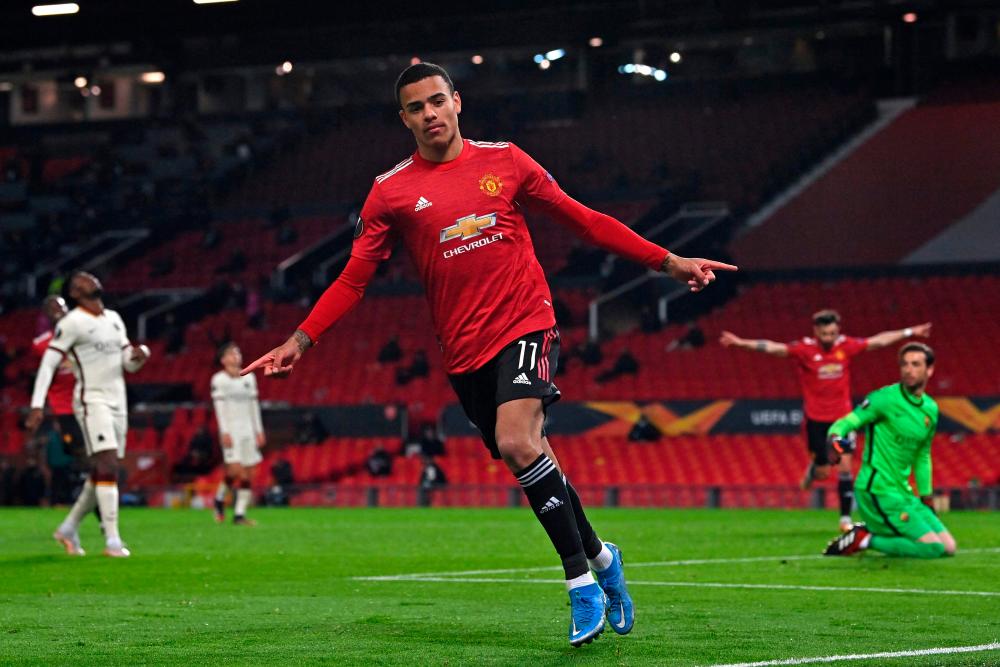 Manchester United's English striker Mason Greenwood celebrates after scoring their sixth goal during the UEFA Europa League semi-final first leg football match between Manchester United and Roma at Old Trafford stadium in Manchester/AFPPIC/FILEPIC