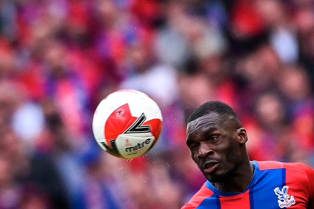 (FILES) In this file photo taken on April 17, 2022 Crystal Palace's Zaire-born Belgian striker Christian Benteke heads the ball during the English FA Cup semi-final football match between Chelsea and Crystal Palace at Wembley Stadium in north west London. AFPPIX