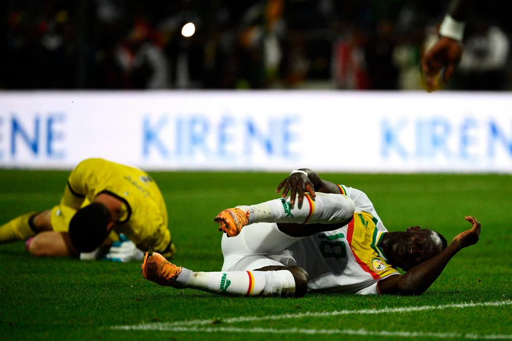 Senegal’s forward Sadio Mane (right) reacts on the ground during the friendly match against Bolivia in Orleans, France on Sept 24, 2022. – AFPPIX/FILEPIX
