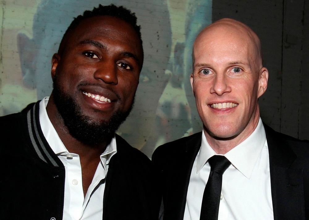 In this file photo taken on January 9, 2017, US sportswriter Grant Wahl (R) and US football player Jozy Altidore (L) attend the 2017 St. Luke Foundation for Haiti Benefit hosted by Kenneth Cole at the Garage in New York City/AFPPix