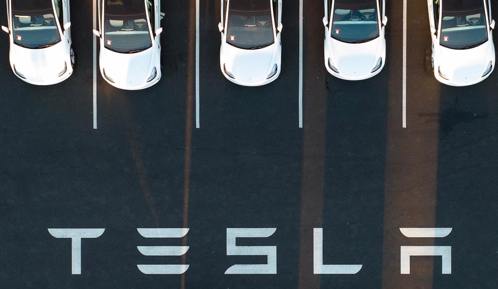 An aerial view shows cars parked at the Tesla factory in Fremont, California. – AFPpic
